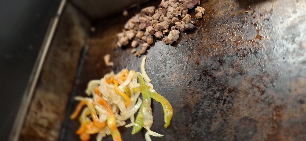 Peppers and onions on the griddle