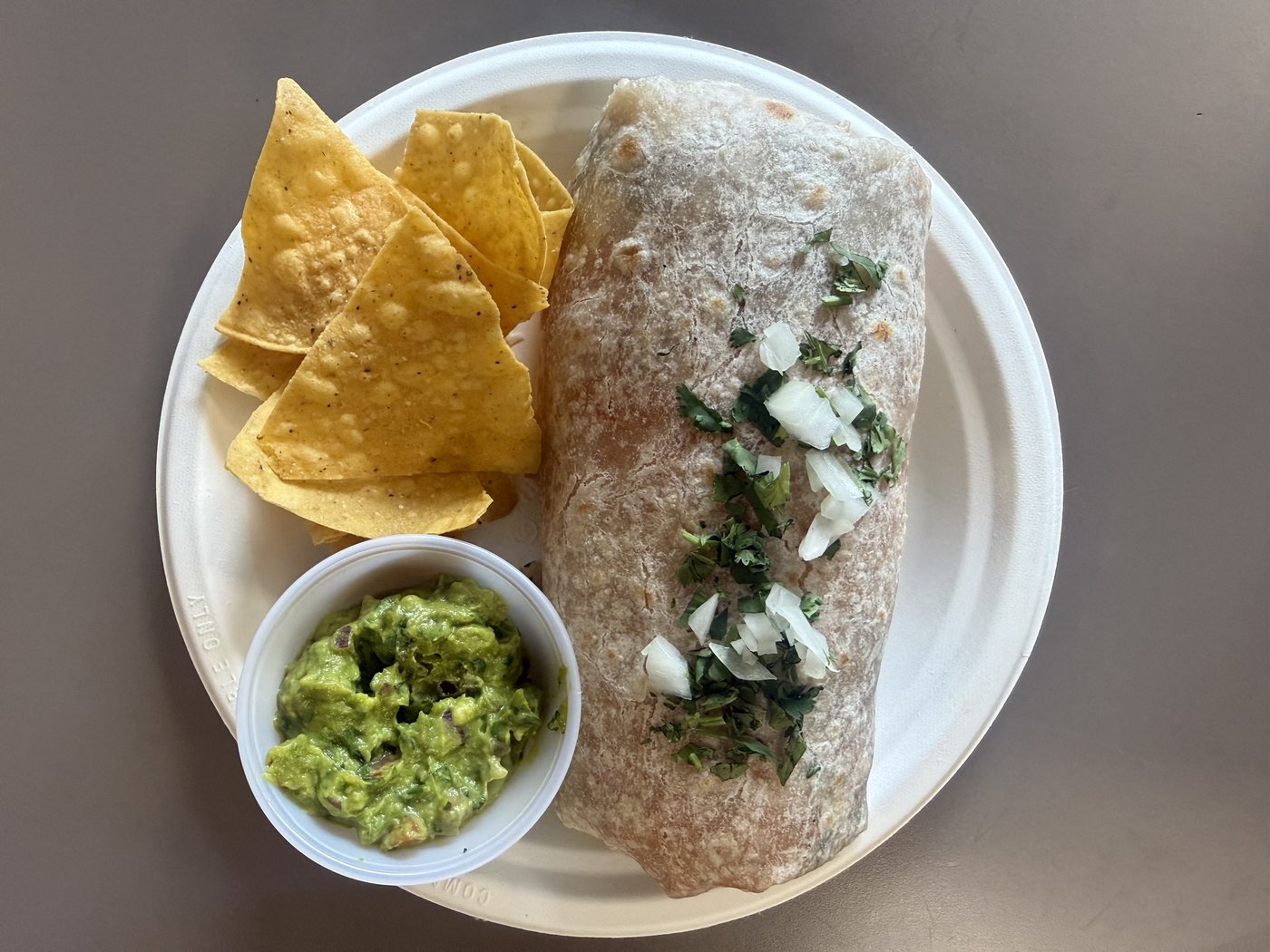 Burrito with chips and guacamole